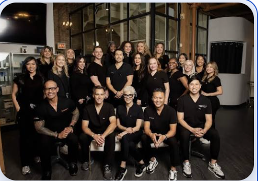 The Chicago Aesthetics practice team together in black uniforms